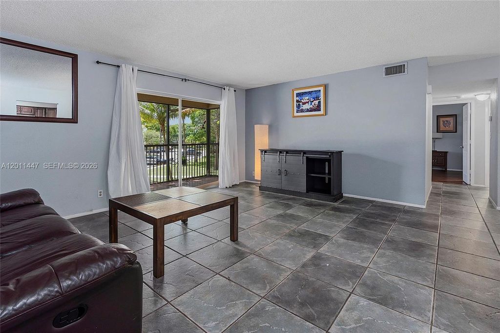 Photo of 3083 N Oakland Forest Dr #206, Oakland Park, FL 33309 (MLS # A12011447)