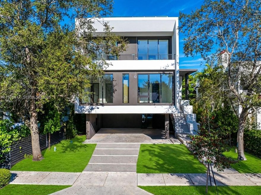 Experience elevated luxury in this exceptional Coconut Grove residence, where open-concept interiors, bespoke built-ins, and refined finishes define effortless sophistication. This 5BR/5.5BA home features a gracious family room and private elevator, crafted with timeless elegance. The first-floor summer kitchen enhances seamless indoor-outdoor living, while the spectacular rooftop terrace offers sweeping bay views and the option to add a private jacuzzi, perfect for serene relaxation or stylish entertaining. The primary suite exudes boutique-style comfort with a tranquil terrace and expansive walk-in closets.