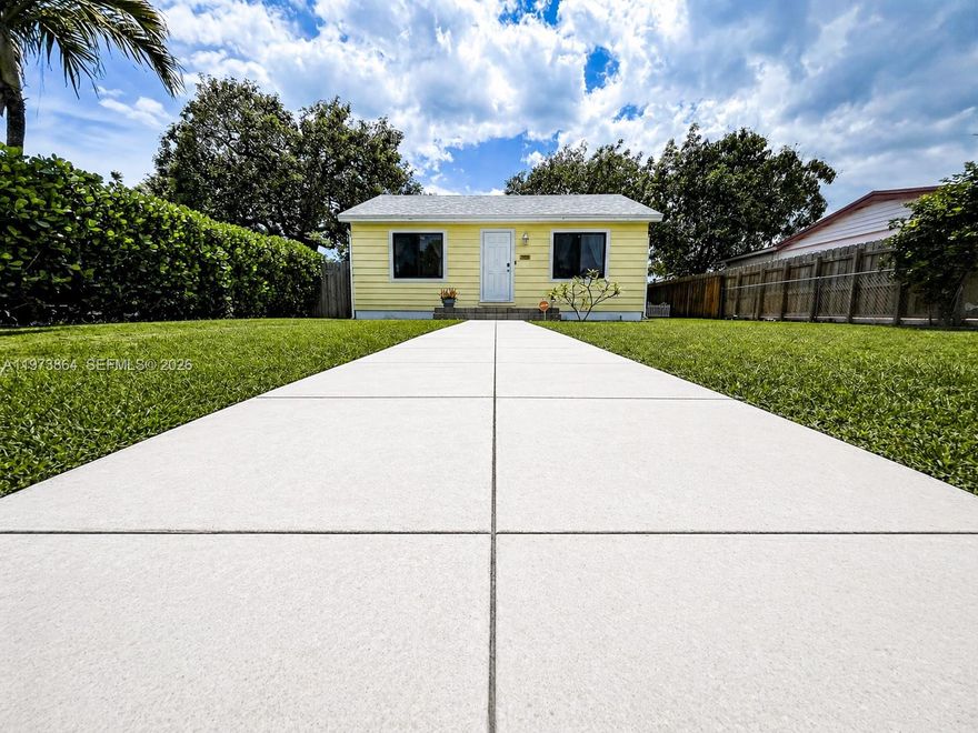PRICE REDUCED—MOTIVATED SELLER! Fall in love with this beautifully reimagined Hollywood cottage styled home, where modern peace of mind meets timeless charm. Boasting a brand-new December 2025 roof (with warranty), full impact windows and doors, an updated electrical panel, and a newer central AC system, this home is truly turnkey.

The bright, airy interior features gleaming hardwood floors, fresh paint, and a sleek open kitchen equipped with a gas range and matching appliances. The primary bath is a modern retreat with a stylish walk-in shower. For a truly seamless transition, the designer-selected furniture is also negotiable!

Outdoors, discover a private tropical oasis on an oversized 6,700+ sq. ft. lot featuring mature avocado trees, a large storage shed, and a rare 30-amp RV hookup with septic drain access. Perfectly situated for the ultimate South Florida lifestyle: minutes from Downtown Hollywood’s dining, approximately 3 miles to Hollywood’s famous Beach and Dog Beach, and approximately 2 miles to Dania Pointe. Prepared for a quick closing—bring your offers!