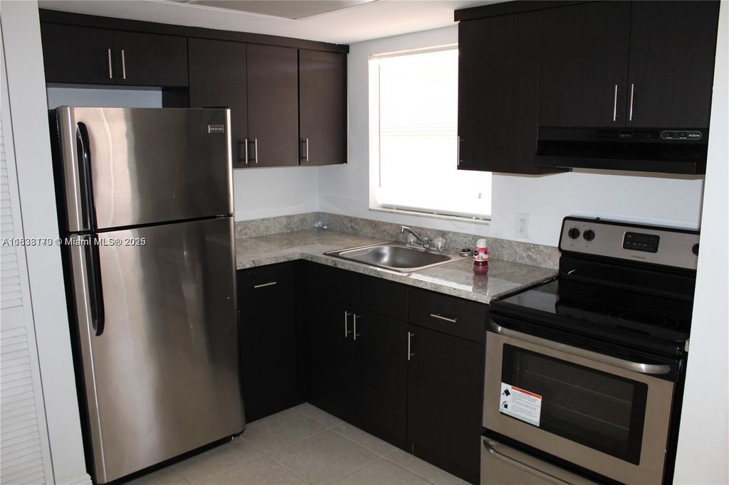 Photo of 101 NE 41st St #F107, Oakland Park, FL 33334 (MLS # A11833170)