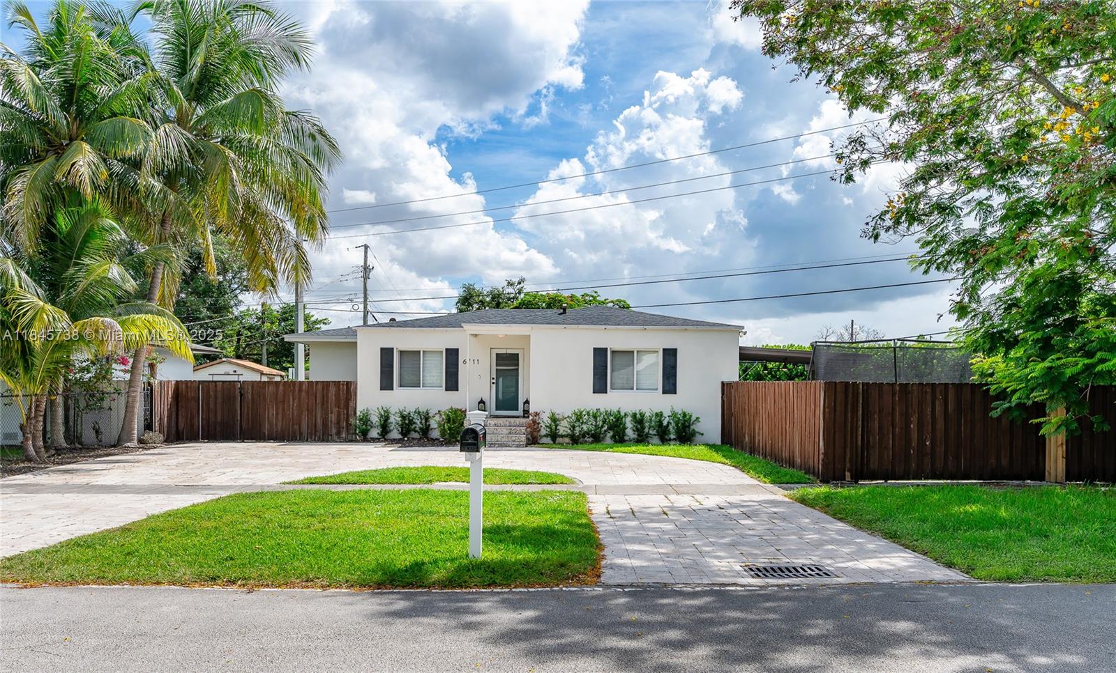 Actual Living Sqft is Larger than Tax Roll: 1587sqft! Welcome to this stunning, move-in ready home perfectly situated near Coral Gables and South Miami with easy access to major highways. Sitting on a spacious 9,000 sq ft corner lot, this property features a fully permitted addition completed in 2020, impact doors and windows, and a newer roof installed in 2020 for peace of mind. Inside, you'll find a custom kitchen with quartz countertops, a built-in breakfast nook, and a large pantry. Renovated bathrooms, a dedicated laundry room, and thoughtfully designed built-ins add both function and style. Enjoy indoor-outdoor living with beautifully landscaped privacy trees, a pergola (2022), putting green, and low-maintenance artificial turf completed in 2024.