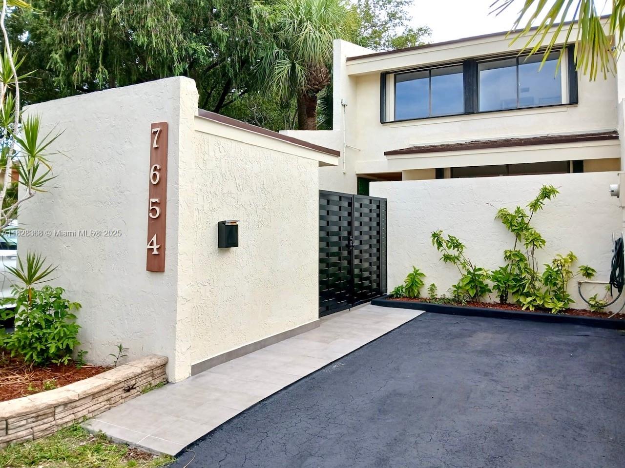 Live your best life in this resort-style Kendalltown Community! Beautifully renovated townhouse offers a sleek, open-concept layout with 3 spacious bedrooms and 3 full bathrooms. Kitchen boasts new stainless-steel appliances, custom cabinetry, and modern quartz countertops. Bathrooms have been stylishly redesigned with contemporary fixtures. Additional highlights: new lighting fixtures, brand-new roof, accordion hurricane shutters, and an inviting private patio ideal for relaxing. Kendalltown offers amazing amenities: 9 tennis courts, a pickleball court, children's playground, fully equipped gym, wonderful, heated swimming pool ideal for water exercise or family fun. Plus, a fabulous clubhouse featuring a party salon available to residents at an affordable rental rate. Move-in-ready home.