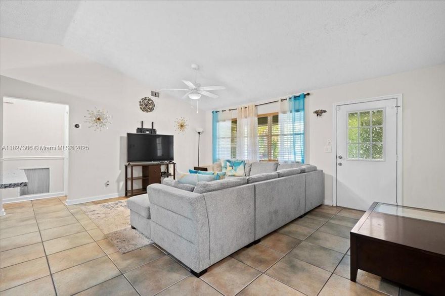 Discover this beautifully renovated 3-bedroom, 2-bathroom home with a spacious 2-car garage, perfectly situated in the highly desirable Indian River Estates community. Featuring a 4- YEAR OLD ROOF, this property combines comfort and peace of mind. Inside, you'll find an inviting open floor plan that includes a generous den/flex space—ideal for a home office, playroom, or additional living area. Enjoy peaceful mornings on the charming screened-in front porch, the perfect spot to relax with your coffee and watch the sunrise. The large backyard is a true highlight, offering ample space for gatherings, grilling, or simply unwinding under the evening sky. With modern updates, flexible living space, and a prime location, this home checks all the boxes—schedule your showing today!