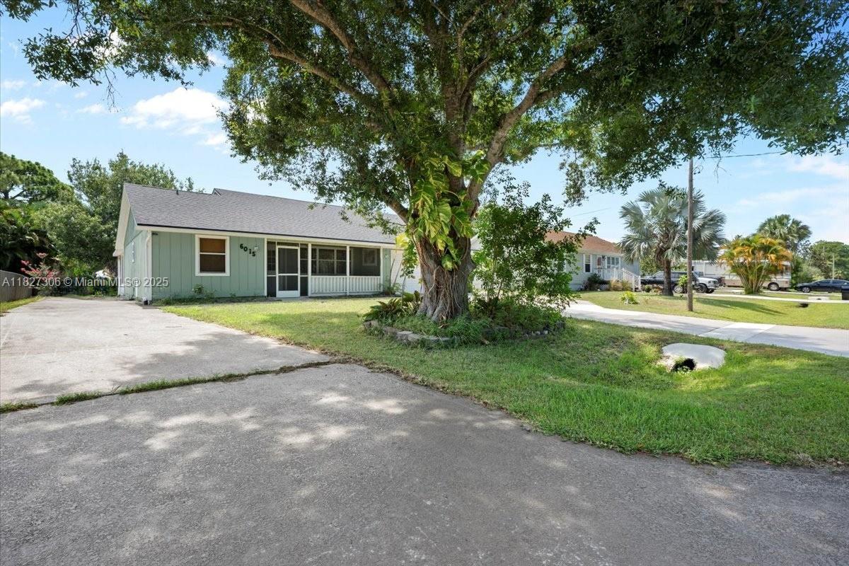 Discover this beautifully renovated 3-bedroom, 2-bathroom home with a spacious 2-car garage, perfectly situated in the highly desirable Indian River Estates community. Inside, you'll find an inviting open floor plan that includes a generous den/flex space—ideal for a home office, playroom, or additional living area. Enjoy peaceful mornings on the charming screened-in front porch, the ideal spot to relax with your coffee and watch the sunrise. The large backyard is a true highlight, offering ample space for gatherings, grilling, or simply unwinding under the evening sky. With modern updates, flexible living space, and a prime location, this home checks all the boxes—schedule your showing today!