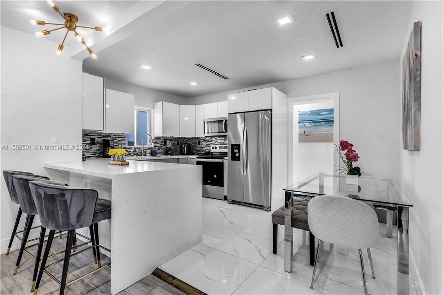GREAT FOR INVESTORS!!! PERFECT FOR A FAMILY ALSO!!! PRIME LOCATION!!! This house is located in the heart of Design district. walking distance to Wynwood and a few minutes driving to South Beach. Complete renovated 5/3 with 2 full kitchens and the possibility of using one part as 3/2 and another part as 2/1. New owner can use it as a double source of income. This includes a new foundation and flat roof, new plumbing and electrical. modern and stylish stainless steel appliances. This beautiful house is set up as a Smart Home with wifi swiches which seamlessly controls lights, locks, Ring cameras, A/C thermostat and music. The outdoor space is quiet and good neighbors. We recently added a Jacuzzi at the backyard. Also there is a BBQ area. House has a separate shed for storage and laundry.