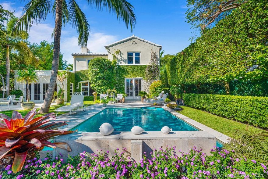 Ideally situated on oversized nearly 10,000 SF waterfront lot, this gorgeously renovated 2story Deco dream awaits its new owners. Residence is fully gated & lushly landscaped for the utmost privacy on 65ft of navigable waters. Home features rarely available 4,278 total SF & 5bd + FamilyRm floorplan (easily convertible to a 6th bd/1st FlrMstr). Once inside, bright&light living spaces feature coral tile flooring, unique fixtures & high-end finishes throughout. 3bds up, each w/ ensuite Bath + separate stairway leading to semi-detached 2 add’l bdr/office areas w/ full bath. Master suite offers its own terrace! Add'l offerings include impact glass,2 CG & full home surveillance system. Relax after a long day by the courtyard fountain,heated saltwater pool,or your very own coral tiled patio&dock!