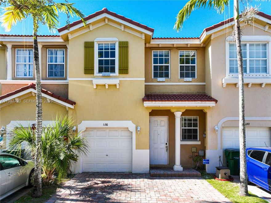 Welcome to this well-maintained 3-bedroom, 2.5-bath townhome in the gated community of Portofino Villas West in Homestead. This spacious home features tile flooring throughout the first floor and a functional layout ideal for everyday living. The kitchen offers stainless steel appliances, ample cabinetry, and generous counter space. Upstairs, all bedrooms are carpeted and filled with natural light, including a primary suite with a soaking tub and separate shower. Additional highlights include a one-car garage, private driveway, and plenty of storage. Community amenities include a pool and clubhouse. Conveniently located near Homestead Baptist Hospital, Homestead Air Reserve Base, Campbell Drive, and the Florida Turnpike, with schools, shopping, and dining nearby. Don’t miss the 3D virtual tour.