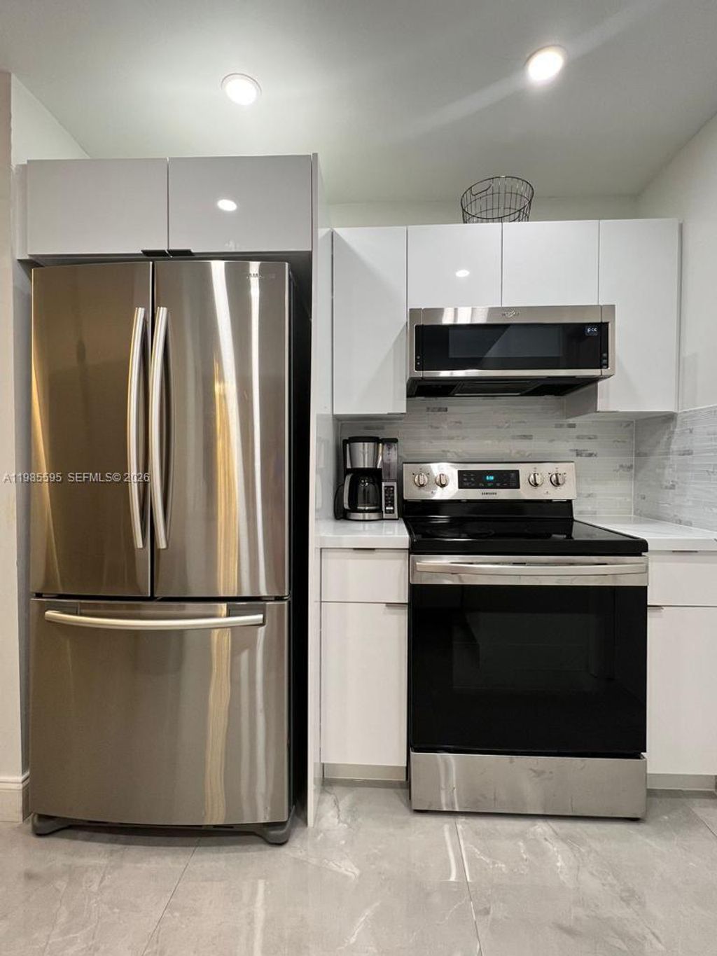 Photo of 7303 NW 57th Dr, Tamarac, FL 33321 (MLS # A11985595)