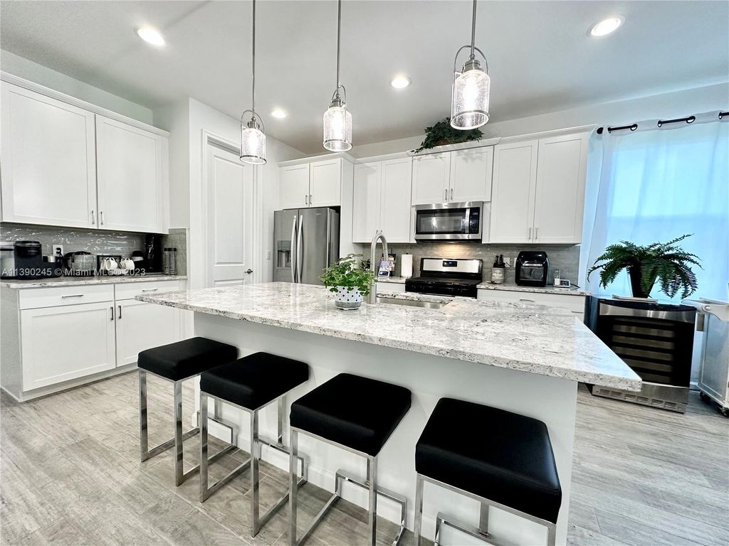 Photo of 11340 SW Lyra Dr, Port Saint Lucie, FL 34987 (MLS # A11390245)