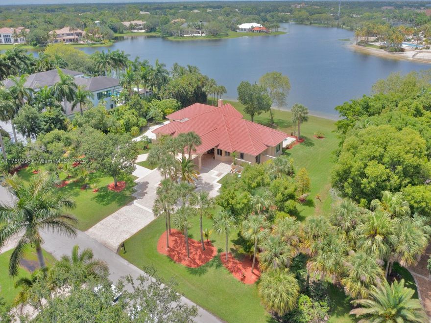 REBUILT IN 2014 WITH NEW IMPACT WINDOWS, TRUSSES, ELECTRICAL, PLUMBING, AND A/C. THIS HOME IS SITUATED ON 1.67 ACRES IN PRESTIGIOUS WINDMILL RANCH ESTATES WITH THE MOST STUNNING LAKE VIEW. FEATURES 7 BEDROOMS 5 BATHS, GRANITE KITCHEN COUNTER TOP, STAINLESS STEEL APPLIANCES, MARBLE TILE FLOOR, RECESS LIGHTS, FRUIT TREES AND DRIVEWAY TO ACCOMMODATE APPROXIMATELY 10 CARS. SPRINKLER.ALL PERMITS ATTACHEDBedrooms:7
Bathrooms:5
Interior Features:First Floor Entry, Closet Cabinetry, Dome Kitchen, Entrance Foyer, French Doors, Laundry Tub, Pantry, Attic, Den/Library/Office, Family Room, Florida Room, Great Room, Utility/Laundry In Garage, Utility Room/LaundryElectric Description:Circuit Breakers
Water Source:Laked Drain
Sewer:Public Sewer
Laundry Features:Laundry Tub, In Garage, Utility Room