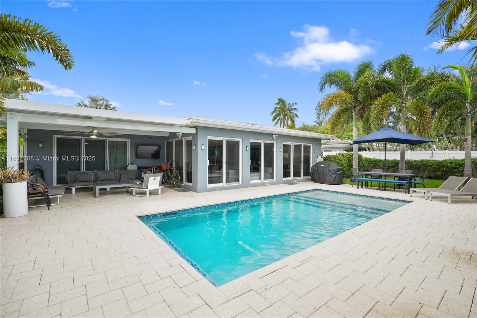 SEASONAL RENTAL available September 2025 - January 2026. Spacious and updated 3 bed 3 bath pool home, just 10 mins from downtown Fort Lauderdale, 15 mins to the airport, and 5 min to the beach. This home is built for indoor-outdoor living. The living space gets great natural light thanks to a full wall of windows, and the kitchen is equipped with top-of-the-line appliances, sleek cabinetry, and plenty of counter space. The heated saltwater pool has a wrap-around ledge, great for relaxing and entertaining. The third bedroom has its own private entry, ideal for a bedroom or flex space. Other features include a wrap-around driveway with ample parking, Ring security cameras, 24/7 ADT monitoring, and a UV-filtered HVAC system. Can be rented FURNISHED OR UNFURNISHED.