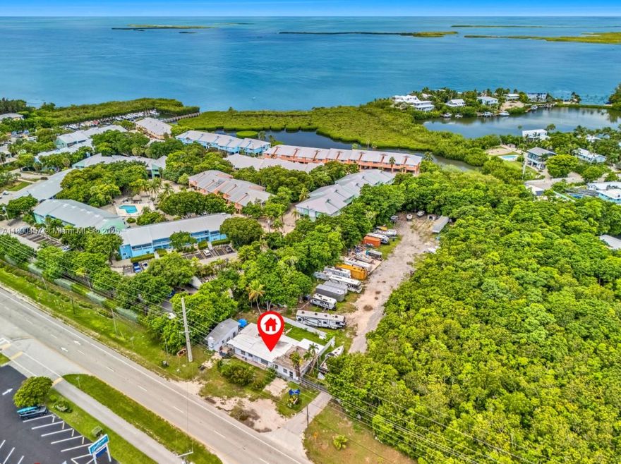 INCREDIBLE OPPORTUNITY! 
125 feet of Road frontage on Overseas Highway 
Storage Yard Facility with Marina License located on the Bay Side 
Property has many improvements including office building and living space with additional separate cottage
Don't miss out on this amazing opportunity 
CALL L/A for showings and details 
Do not visit the property without an appointment