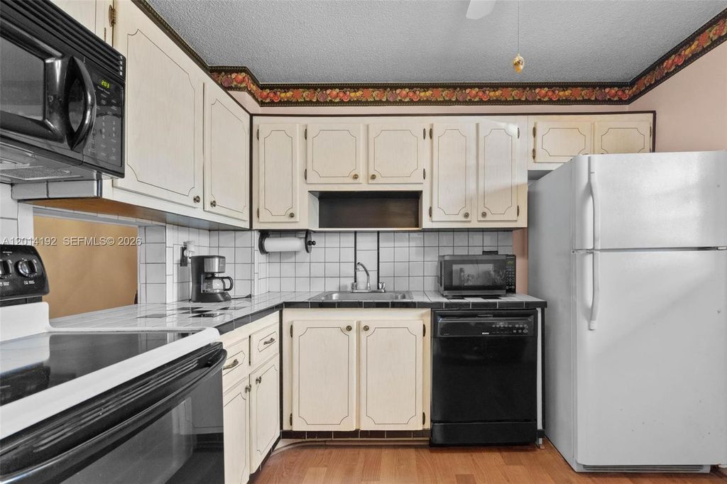 Photo of 100 Berkley Rd #106, Hollywood, FL 33024 (MLS # A12014192)
