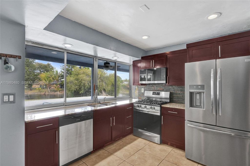 Photo of 8699 NW 26th Pl, Sunrise, FL 33322 (MLS # A11980480)