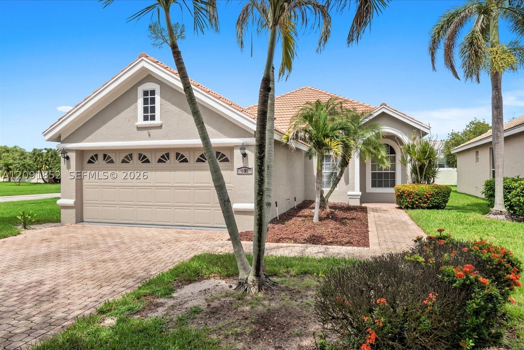 Photo of 827 SW Lake Charles Cir, Port St Lucie, FL 34986 (MLS # A12091852)