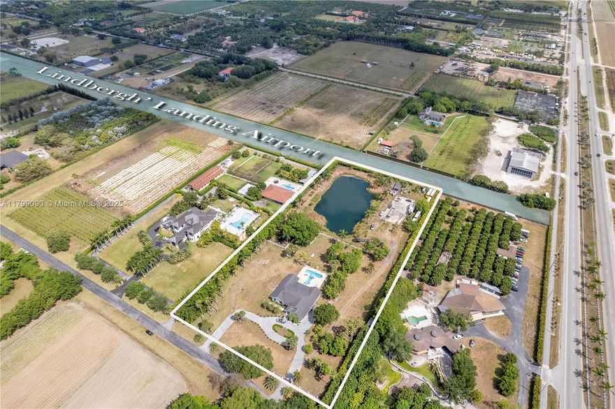 Fly-In Living at Lindbergh's Landing! Discover luxury and adventure in this remodeled 5-bedroom, 3-bath home located in the exclusive Lindbergh's Landing community, where you can fly in and park your plane right on your property. This stunning residence features 5.6+ Acres, an open layout, porcelain floors, Smart Film impact windows, custom cabinetry, and a newer roof. A spacious sunroom provides versatile space for entertaining and flows seamlessly to the custom-built pool. Enjoy pristine water with a UV filtration system. The 5th bedroom offers flexibility as an additional room, guest suite, or home office. Embrace country living near farms, golf courses, and scenic trails. Your aviation lifestyle awaits!