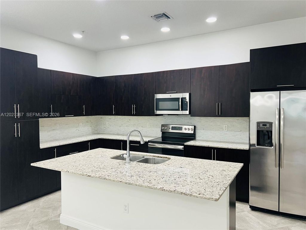 Photo of 12432 NW 18th Ct, Pembroke Pines, FL 33028 (MLS # A12021367)
