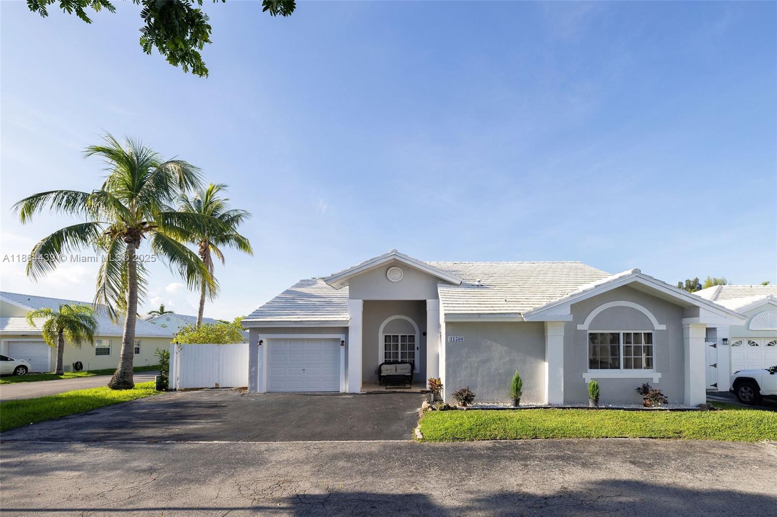 Remodeled home with swimming pool in the popular 24-hour guard gated community, Britannia Estates! Upon entering the home, notice the vaulted ceilings that add volume to the space. A wall has been removed to create an open kitchen and feel. There are impact windows and doors, updated flooring, kitchen & bathrooms & extra storage. LOOKING TO GO SOLAR? This home has it, with a full set of panels complete w/ a Tesla battery, providing storage in case of a cloudy day or storm. See floor plan in the photos, there are 3 bedrooms, 2 bathrooms, plus a den used a 4th bedroom. Situated on a corner lot, this home feels private. The community offers plenty of guest parking, an extra community pool, tennis court, front lawn service, and the guard gated entrance. Showings are appointment only.