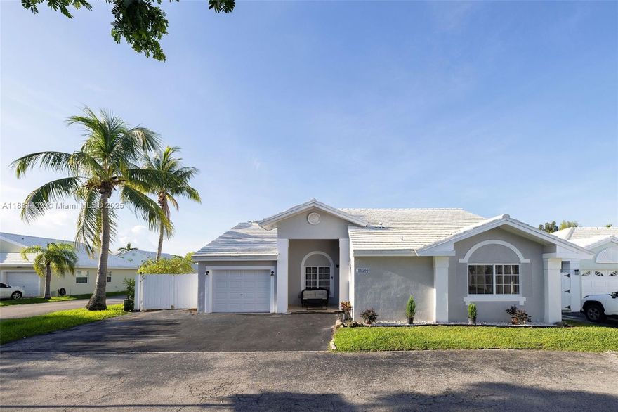Remodeled home with swimming pool in the popular 24-hour guard gated community, Britannia Estates! Upon entering the home, notice the vaulted ceilings that add volume to the space. A wall has been removed to create an open kitchen and feel.  There are impact windows and doors, updated flooring, kitchen & bathrooms & extra storage.  LOOKING TO GO SOLAR? This home has it, with a full set of panels complete w/ a Tesla battery, providing storage in case of a cloudy day or storm.  See floor plan in the photos, there are 3 bedrooms, 2 bathrooms, plus a den used a 4th bedroom. Situated on a corner lot, this home feels private. The community offers plenty of guest parking, an extra community pool, tennis court, front lawn service, and the guard gated entrance.  Showings are appointment only.
