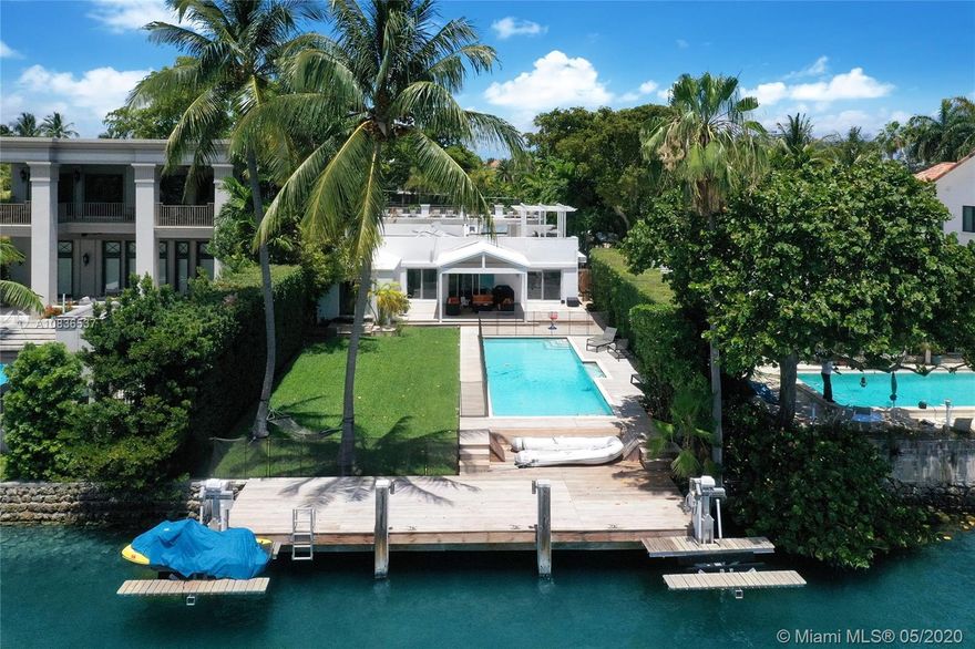 The least expensive waterfront property on exclusive gated Hibiscus Island in South Beach, minutes from World famous Ocean Drive, Downtown Miami & Brickell. Make it your home or tear it down & build another luxurious Palace on the Island! One of the last waterfront homes or site available at close to land value. The Island also includes tennis courts for outdoor sports. The private dock for your boat & jet ski lifts overlook the peaceful wide canal. Property has direct access to the Intracoastal Waterways & the Ocean. Great floor plan: a separate wing at entrance leads to 2 bed/2 baths. Den/office enjoys the entire living area. 2 master suites open to the pool deck & overlook the  Palaces of Palm Island across the sparkling blue waters. Enjoy South exposure & Downtown views! CASH DEAL ONLY