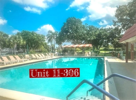 Photo of 9410 N Hollybrook Lake Dr #306, Pembroke Pines, FL 33025 (MLS # A12094583)