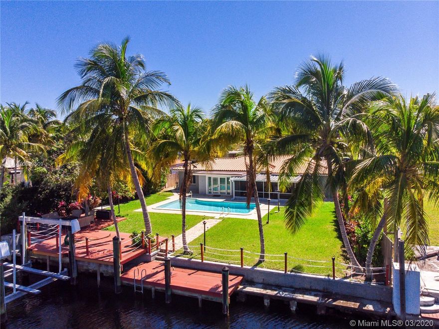 BEAUTIFUL 3 BEDROOM, 2 BATHROOMS IN GATED COMMUNITY OF KEYSTONE POINT. HUGE LOT 10,387 SQ FT WITH CIRCULAR DRIVEWAY FOR PARKING MULTIPLE VEHICLES. 80FT WATER FRONTAGE, BOAT LIFT WITH 15,000LBS CAPACITY. AMAZING POOL, STAINLESS STEEL APPLIANCES, GRANITE COUNTER TOPS. DIRECT ACCESS TO BAY. NO FIXED BRIDGES. PERFECT HOME FOR THE AVID BOATER. LOCATED 20 MINUTES TO DOWNTOWN MIAMI, MINUTES TO BAL HARBOUR, THE BEACHES AND AVENTURA. "A" RATED SCHOOLS. NO ASSOCIATION FEES. 24 HRS GUARD GATED COMMUNITY.