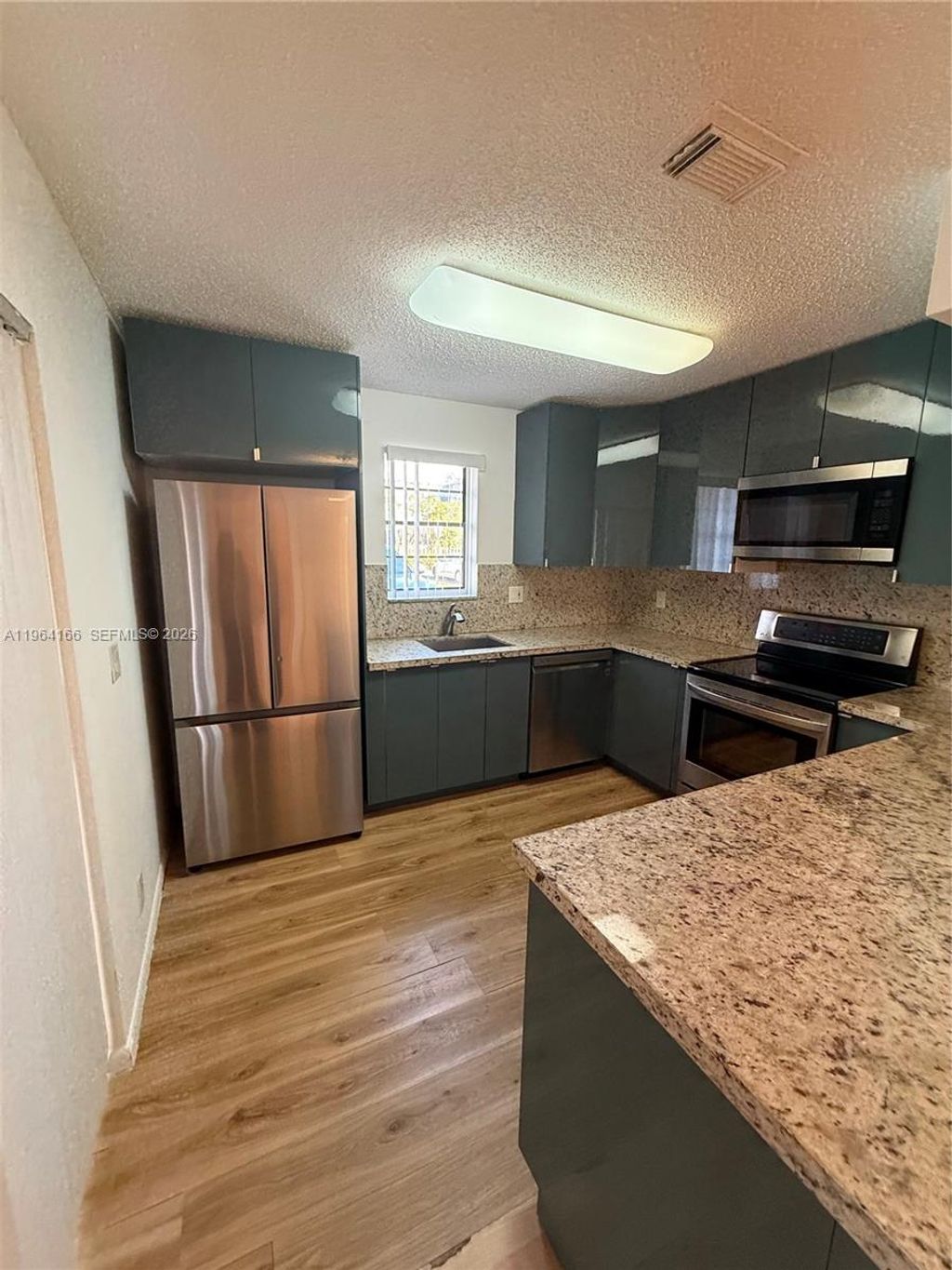 Photo of 2515 NW 99th Ave #2515, Coral Springs, FL 33065 (MLS # A11964166)