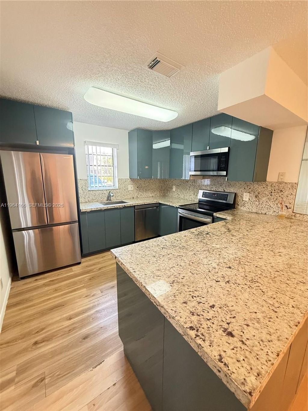 Photo of 2515 NW 99th Ave #2515, Coral Springs, FL 33065 (MLS # A11964166)