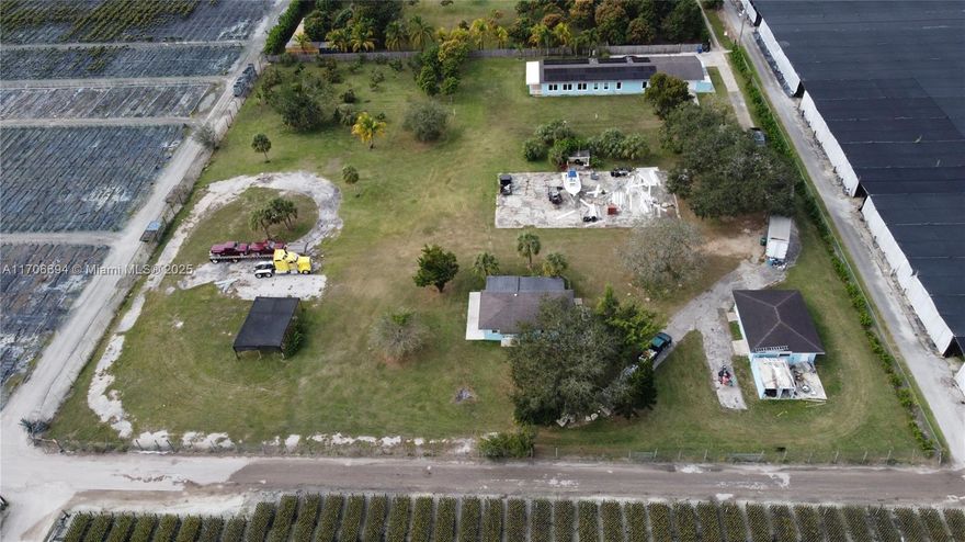 This almost 2.5-acre estate features a beautiful 4 bedrooms 3 bathrooms. The open floor connects to a luxurious kitchen complete with a subzero freezer, subzero refrigerator, 2 lazy Suzy, ice machine, barn sink, eat-at island with lots of cabinets, 2 ovens, and Cortez countertop. The master bath has a garden tub and, a separate shower with 2 sinks. Also features a Spacious  2 bedroom 1 bath In-laws quarters with a split floor plan. Separate garage. Shed/Workshop. Fruit Trees. The property also includes solar panels for energy efficiency and reduce utility costs. Leased $400 per month with roof insurance, lowering your utility cost to appr. $23 month. Regulation size Tennis Court that needs to be refurbished and plenty of room for a pool. Schedule your appt. today!