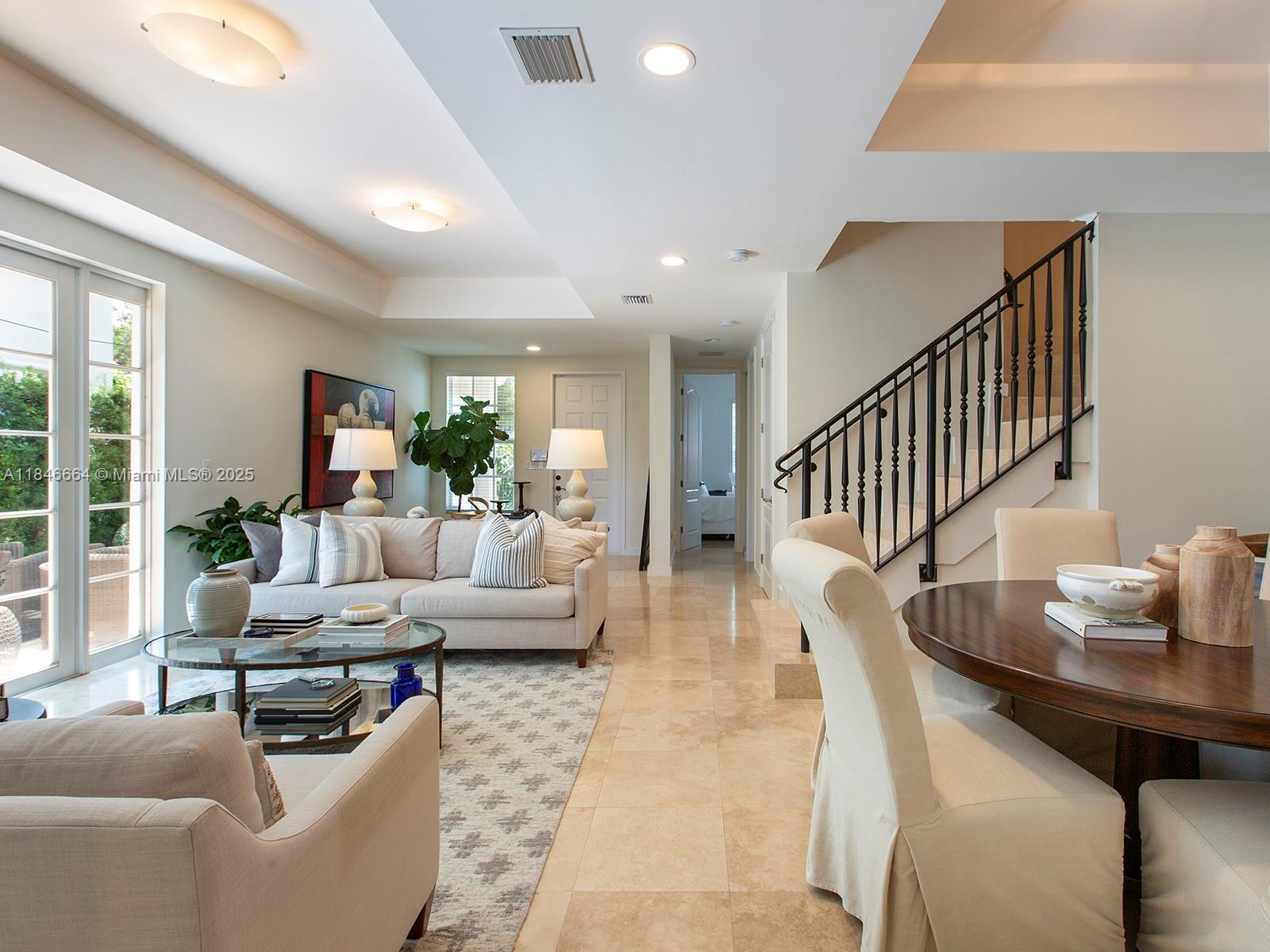 Fabulous corner unit in gated Pine Manor community in South Miami. Sought after C unit with 4 BR/4 BA. Very bright, 2-story Townhome with high ceilings, impact windows & doors, private patio off living room. Large Master suite with private terrace and den or office. His & hers walking closets. Two other ensuite bedrooms on second floor, and 1 additional bedroom on ground floor. Chef kitchen w/gas stove and granite counters. Marble floors. Beautiful community with pool and night security. Close to private and public schools and steps from South Miami shopping. 4 car carport. Sunset Elementary school district.