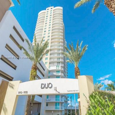 Spacious 2/2 fully furnished and equipped unit with beautiful golf course and city views! Italian style open kitchen w/stainless steel appliances, wood cabinetry, & granite countertops. Building offers 24 hour security, valet parking, business center, cyber cafe, theater, gym, billiard, pool. Prestigious Duo Condominium is within walking distance to the beach (10 minutes). Close to restaurants, food markets and shopping.