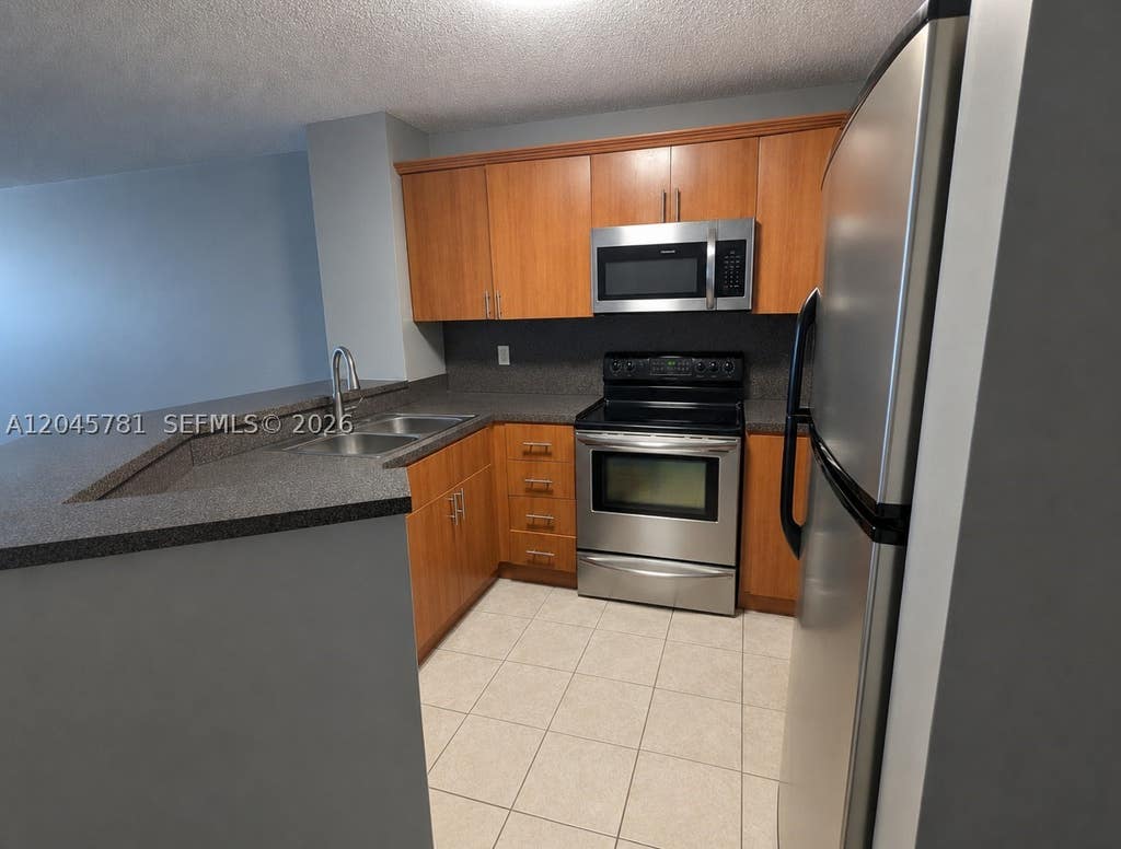 Photo of 8750 N Sherman Cir #403, Miramar, FL 33025 (MLS # A12045781)