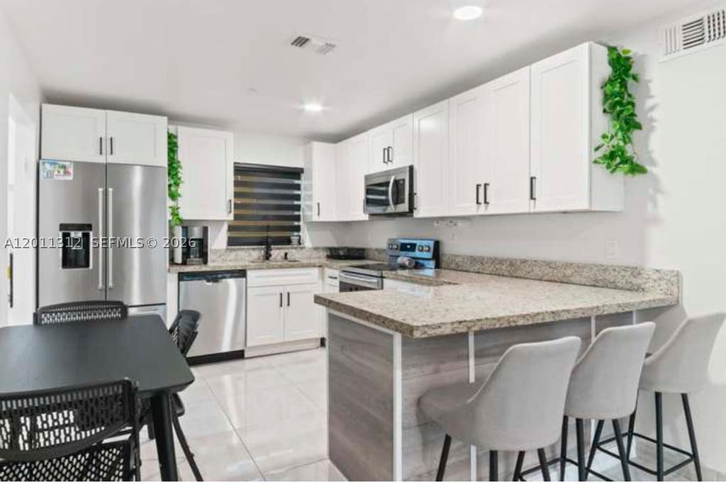Photo of 2320 SW 18th Ter #1, Fort Lauderdale, FL 33315 (MLS # A12011312)