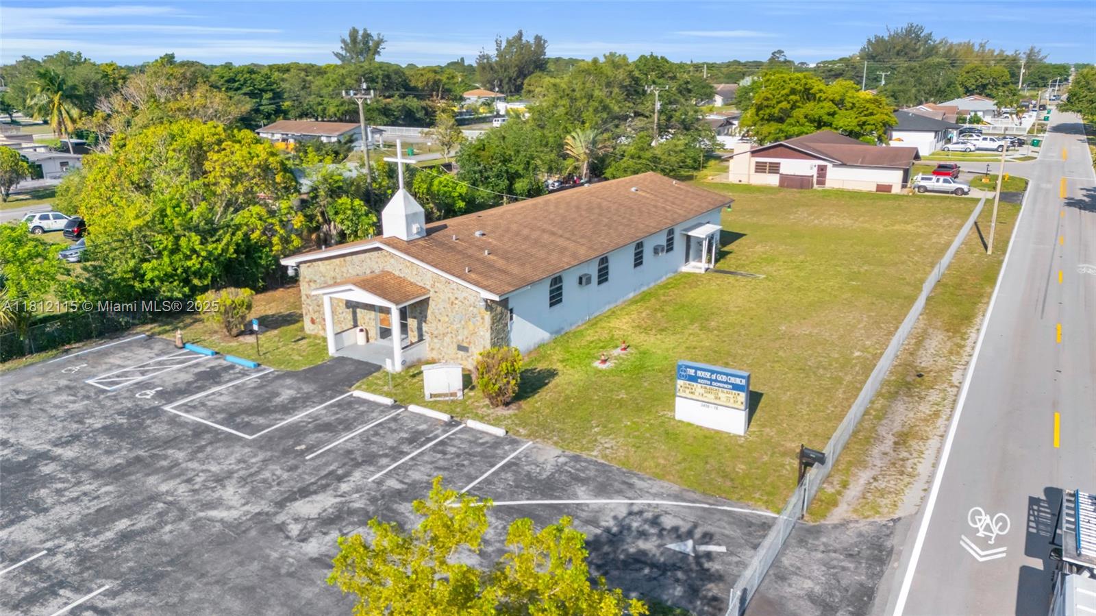 Investor Special! This 4,094 SF one-story church sits on a gated 23,850 SF lot in Miami Gardens, just 10 minutes from Hard Rock Stadium and the future $400M+ City Center. The building features a sanctuary seating comfortably up to 200, two offices, two restrooms, and ample storage, ideal for religious use, events, education, or creative redevelopment. With no HOA and easy access to the Turnpike, you're well connected to downtown Miami and Broward. Property is sold AS-IS. A rare chance to invest in a high-growth area! Extra: adjacent single family home (3420) and vacant land (3480) SEPARATELY available for sale.