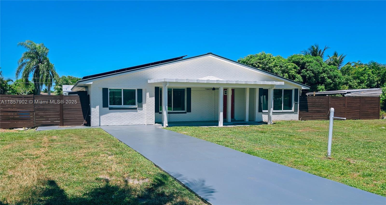 Finally, a rental that’s as fun to live in as it is to show off. This 3-bed, 3-bath Delray Beach home was renovated just last year and features an open-concept kitchen, living, and dining area perfect for everything from dinner parties to Netflix marathons. A brand-new metal roof means no drip-drip drama, and solar panels help keep your electric bill from spiking harder than a beach volleyball.
But let’s be honest, you’re here for the backyard. We’re talking a massive vaulted-ceiling patio, a poolcuzzi that’s part pool, part jet-tub, and an inground trampoline to keep the kids busy 'while the adults are talking'. Whether it’s a lazy Sunday dip, lively barbecue, or a "let's see who can jump higher" contest, this backyard was built for making memories.