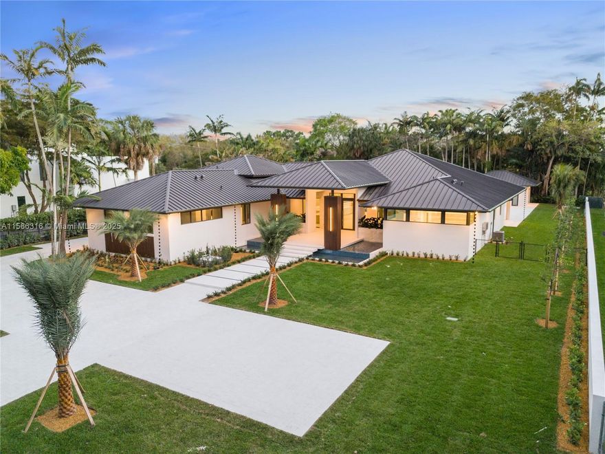Discover the epitome of Miami luxury living w/ this impeccably crafted residence. This brand-new custom-built home sits on a 30,358 sqft lot that is completely secluded and on a private street.  As you approach the home, you'll be greeted by a stunning entryway featuring floating steps that lead you to the front door. On either side of these steps, serene waterfall ponds cascade gently, creating a peaceful ambiance.  This 5 bedroom 6 and 1/2 bath home will offer a total of 7,359 sqft. Features include a metal roof, ensuite baths, exquisite tile, custom Italian cabinetry, covered terrace for indoor and outdoor entertaining, pickleball/basketball court, outdoor gazebo with built in kitchen with cascading waterfall bar, and more.