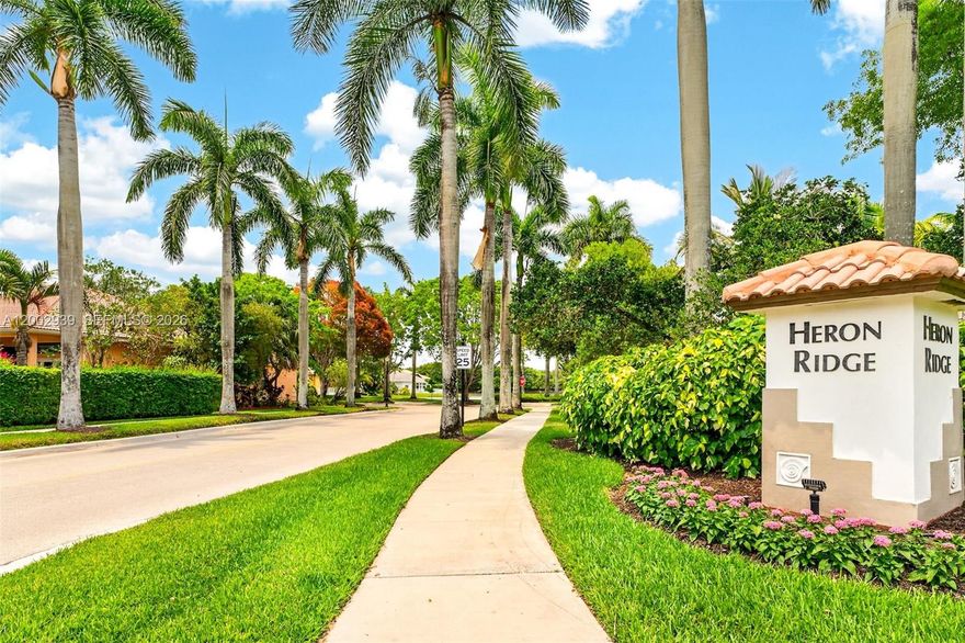Rare opportunity in The Ridges, Weston! Original Owner!! Largest one-story waterfront pool home currently available, ideally situated at the end of a quiet cul-de-sac. This 4-bedroom, 2.5-bath residence features a 2024 new roof, 2021 AC, new hot water heater, spacious open kitchen, formal living room, formal dining room, oversized bedrooms, separate laundry room, 2-car garage, and an extended driveway with ample parking. Enjoy peaceful waterfront privacy from the screened pool enclosure, with direct access from both the primary suite and kitchen—perfect for indoor-outdoor living and entertaining. Lovingly maintained by the original owner, this home offers incredible potential to add your own updates and finishing touches. Priced to sell, with low taxes, in a highly desirable gated community featuring a community pool, tennis courts, and more. There is truly nothing else like it on the market for size, location, pool & water.