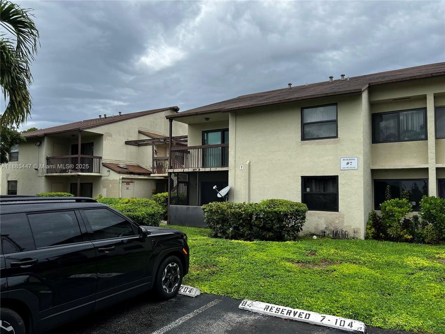 This first-floor gem garden-style-walk-up offers incredible value and comfort , two-bedroom, two-bath with lake view. Smart open layout and spacious rooms. Extra-large master suite and sitting area with master bathroom and double closets. Large second bedroom with hallway bath. Central HVAC and washer/dryer hook up in unit. Also includes a large balcony with storage. All new impact windows and sliding doors installed in 2025. Come visit this wonderful, small and quiet community with swimming pool near I-95, Route 441/State Rd 7, and the Turnpike, and make it your new home or investment (income producing)