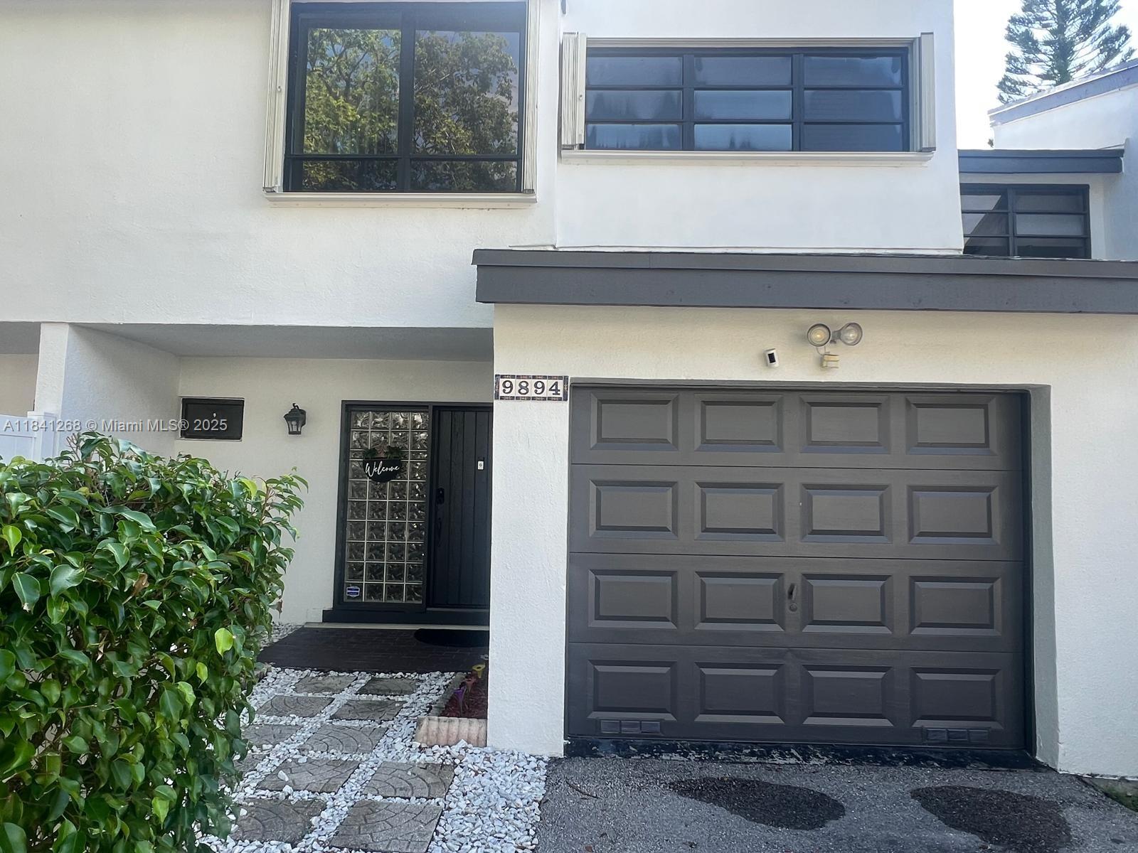 Beautiful townhouse in a central location in Plantation. Spacious rooms with high ceilings at the entrance. Renovated half bath on the first floor, a very large dining/living room area with an exquisite kitchen with wood cabinets, quartz countertops, and stainless steel appliances. On the second floor, there is a huge master bedroom with laminate floors and a very large walk-in closet. The master bathroom has been renovated. The washer and dryer are located on the second floor for your convenience. The rest of the rooms are a very good size, and the second bathroom has also been renovated. The patio has a beautiful view of the lake, and a canopy has been installed, which is perfect for entertaining. Close to shopping, malls, major roads, hospitals, and so much more. Must see!