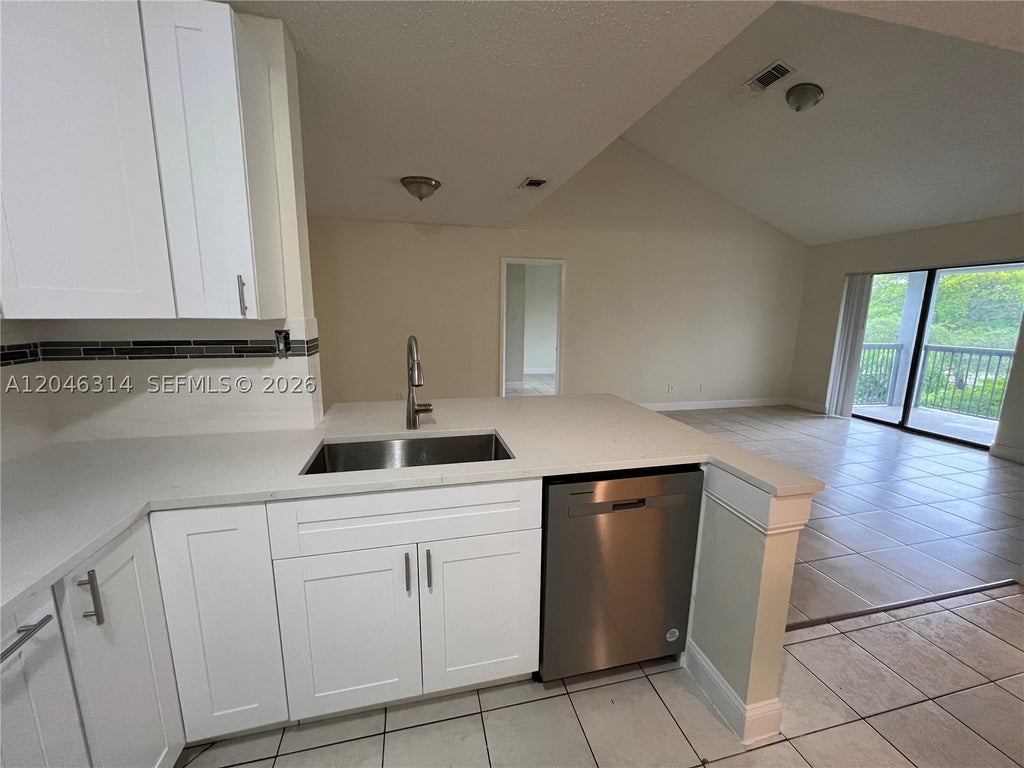 Photo of 11277 W Atlantic Blvd #302, Coral Springs, FL 33071 (MLS # A12046314)