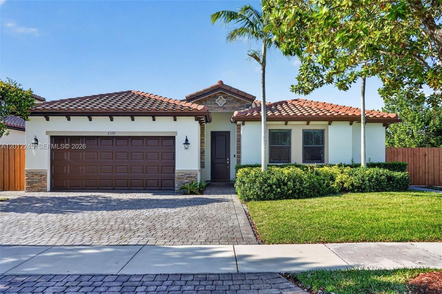 Beautiful turn-key 2019-built single-family home located in the gated community of Portovita in Homestead on a premium corner lot with a playground park directly in front of the property. This spacious 4-bedroom, 3-bath residence features a flexible interior guest/in-law quarters setup, full impact windows installed in 2023, and a stunning backyard designed for entertaining. Enjoy a custom pool with raised spa feature built in 2022, surrounded by elegant Turkish stone, creating a resort-style outdoor setting with excellent backyard curb appeal. Covered terrace completed in 2025, along with side slab and front driveway pavers also completed in 2025. The kitchen includes brand-new refrigerator, stove, and dishwasher, plus a microwave in like-new condition. Additional upgrades include brand-new carpet in the non-primary bedrooms, stunning porcelain tile in the primary bedroom, and a garage with epoxy flooring for a clean, finished look. The home offers a great indoor/outdoor lifestyle with modern upgrades, tropical landscaping, and excellent curb appeal. Community amenities include a clubhouse, resort-style pool, fitness center, playground areas, and gated access. Conveniently located near Baptist Hospital, Publix supermarket, shopping stores, dining, major roads, and the Florida Turnpike. A must-see property with strong upgrades and a premium lot position.