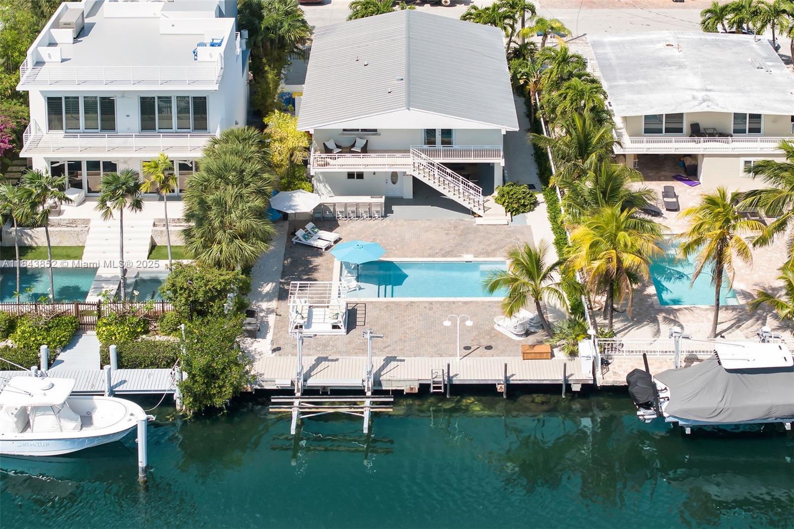 Welcome to paradise. This tastefully furnished 3-bd, 3-bath + has a downstairs cabana lounging area too. Property has a resort-style feel with its ideal waterfront location. With a bright interior, this property provides the perfect blend of comfort and Keys lifestyle. 50 ft private dock +15k boat lift. Location allowing you to explore the stunning waterways of Tavernier. The expansive backyard provides a tranquil space to soak in the breathtaking views of waterway. Relax and unwind in the pool, with an outside bar and ice maker perfect for entertaining - creating unforgettable memories in your own waterfront oasis. Located on the bayside, this property embodies the true essence of Florida waterfront living. Don't miss out on the opportunity to make this waterfront retreat your own.