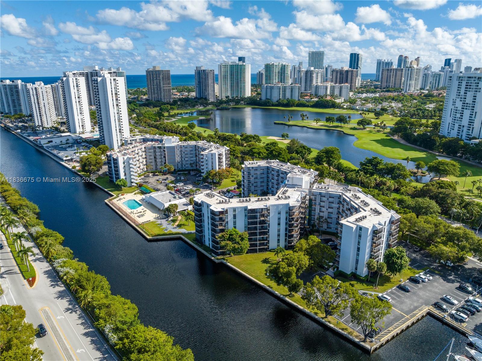 Welcome to this spacious 2-bed, 2-bath condo in the heart of Aventura, perfectly situated along the prestigious Aventura Circle. This unit features a desirable split floor plan, the kitchen is equipped with stainless steel appliances and wood cabinetry, while the entire unit showcases laminate flooring and new blinds and blackouts. Step outside to your wraparound balcony and enjoy peaceful views and fresh air. Amenities include a pool deck overlooking the canal, picnic area, fitness center, pool table, banquet hall/clubhouse, and convenient laundry facilities on every floor. The unit also includes one assigned parking space and a private storage unit. Prime location near Aventura Mall, Turnberry Golf Course, Aventura Park Square, and top-rated schools.