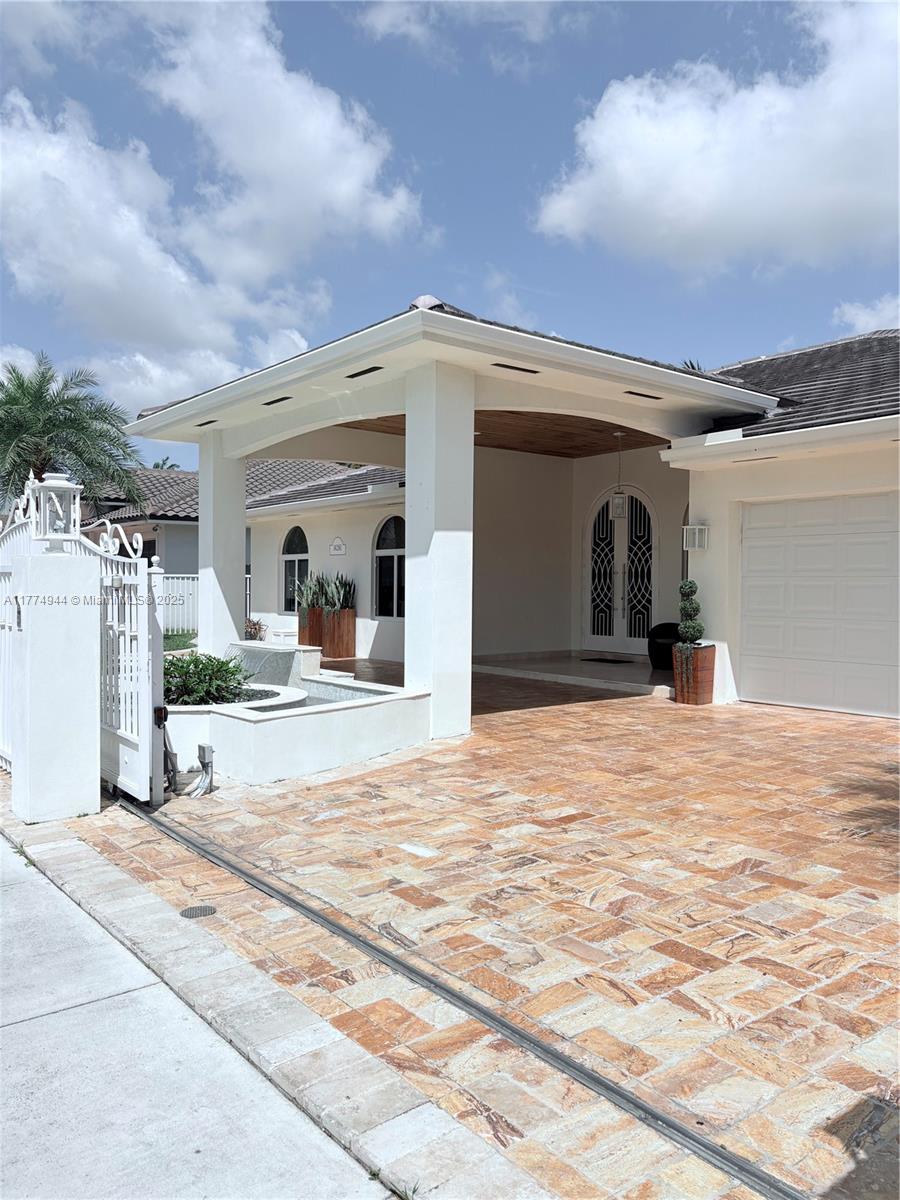 Property has marble floors throughout, marble bathrooms, wood kitchen cabinets with granite counter tops, Viking professional stainless steel appliances, Subzero refrigerator, new roof, impact resistant windows and doors throughout the house and gazebo with professional outdoor rated appliances. Property is gated.