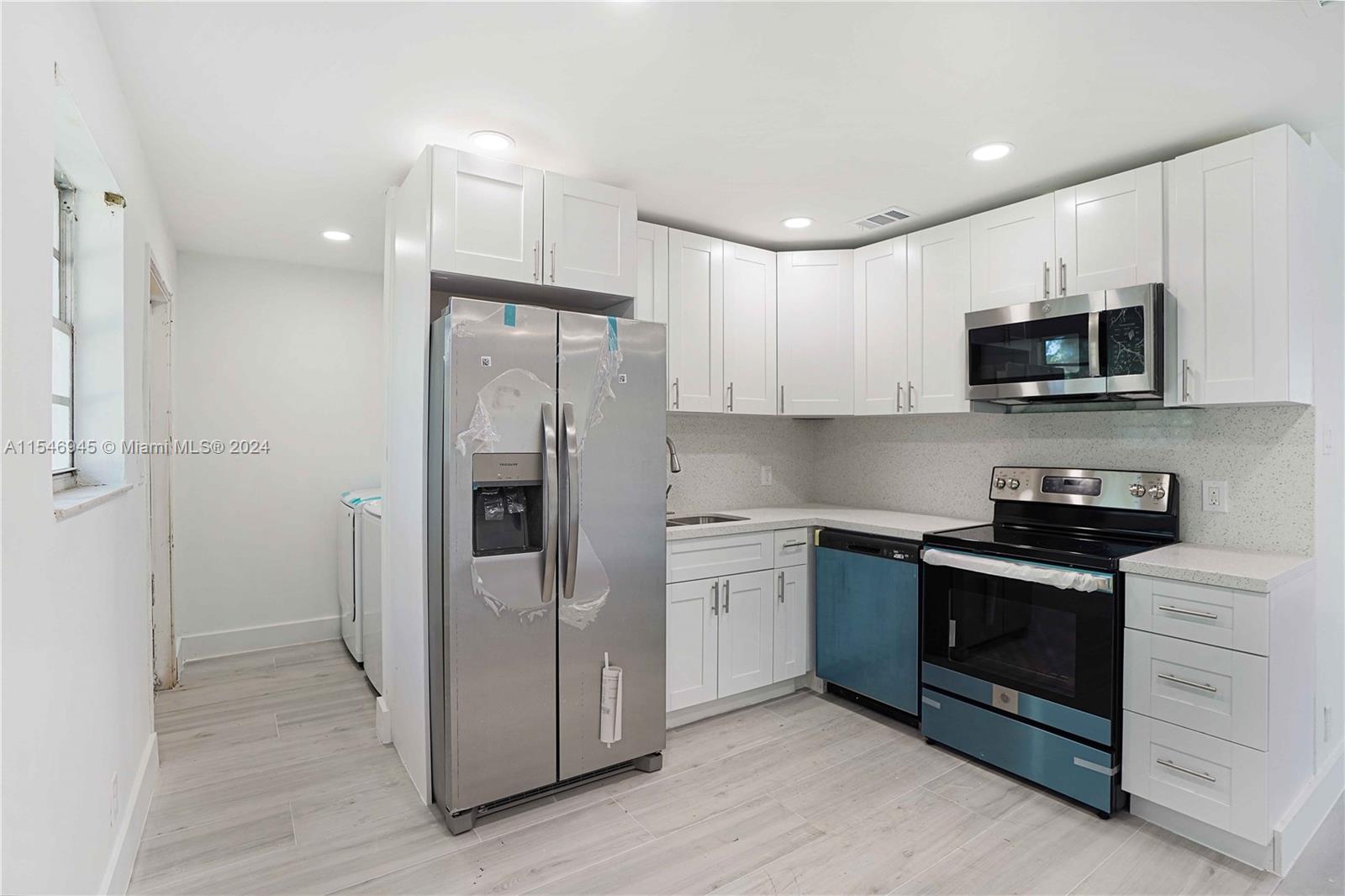 Welcome to your future home! This 2 bedroom and 2 bath unit is located on a huge 27000+ sq ft lot of shared yard space. This twin home has a full interior renovation like a brand-new build. It features a new kitchen, floors, bathrooms, washer, dryer, impact windows, and more. It's a must-live experience. Central LOCATION near I-95 Hwy, South Dixie Hwy, and 5 min from Biscayne Blvd corridor, 20 min from Aventura Mall, 13 min from Sunny Isles Beach, 9 min from Oleta River State Park, 7 min from Costco and Publix.