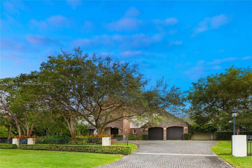 Spectacular 2006 custom built Estate with Sprawling living spaces and back yard. 6-bedroom, 6.5-baths Gourmet Kitchen with large Butler’s pantry, two family rooms, vaulted ceilings and open balcony joining both upper and lower level living areas. Impact windows, backup generator, huge screened in porch and an amazing car collectors dream…7 car garage with workshop and Lift. 1-1 guest house overlooking the yard and Salt filtered pool. Grand entry with Koi pond, circular driveway shaded by mature oaks behind elegant gates.