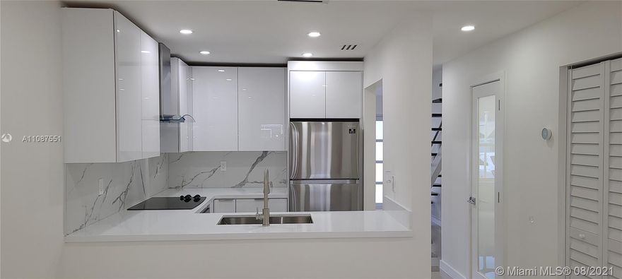 Stunning fully renovated modern style two-story townhouse located in the heart of Fountain blue Community. This townhouse features Impeccable 2 bedroom 2 ½ bathrooms with gorgeous walk-in showers, a brand-new modern style kitchen equipped with stainless-steel appliances, white cabinets, and tile backsplash that gives this unit a modern look with an elegant vibe. Dining room, floating Stairs, glass interior doors, Impact glass exterior windows and doors as well as recess lighting in the entire unit. Balcony and patio with privacy fence and two designated parking spaces with-in feet of the front door. Gated Community, Pet friendly and ideally located within walking distance from restaurants, shops and entertainment. Impeccable condition, price and location make this townhouse a must see!