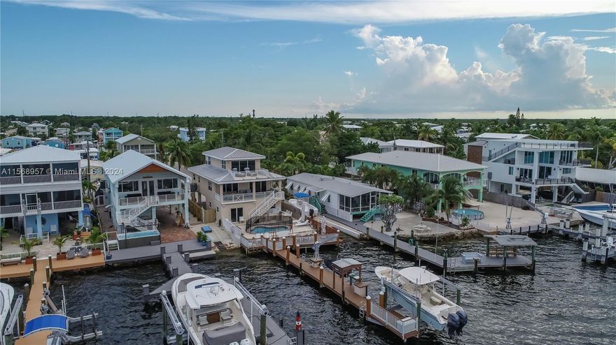 Welcome to Paradise Point, so close and yet a world away.A remarkable, luxurious estate set along the shores of the Florida Bay on Blackwater Sound within minutes of Ocean access through Adam's cut and world famous John Pennekamp State Park. Privacy and Recreation harmoniously coexist in this remarkable 3 Bedroom 2 Bath house, with a Bonus Game room steps away from the pool and wide balconies with 180 degree awe inspiring views of Florida Bay. Discover your own piece of paradise that is an easy commute from Miami by car or by water !