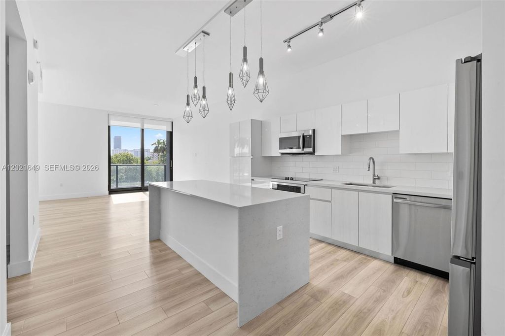 Photo of 101 Diplomat Pkwy #204, Hallandale Beach, FL 33009 (MLS # A12021649)