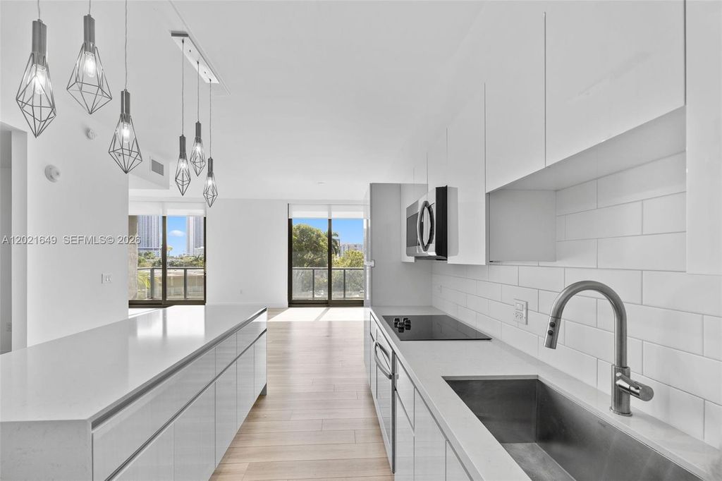 Photo of 101 Diplomat Pkwy #204, Hallandale Beach, FL 33009 (MLS # A12021649)